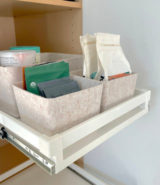 beige sculpted petite in a shelf