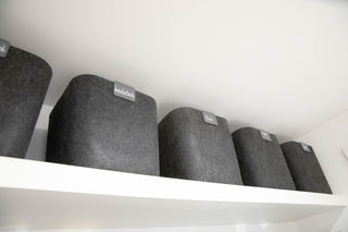 SortJoy Original Sculpted Bins with Labels in a top shelf