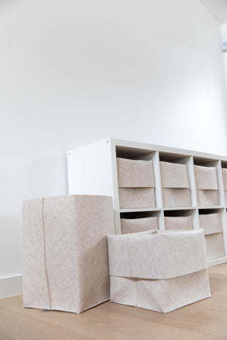 2 oatmeal colored original flex bins with 1 unfolded and 1 folded