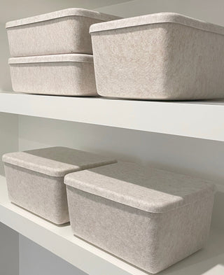Beige wide bin with lid in a shelf