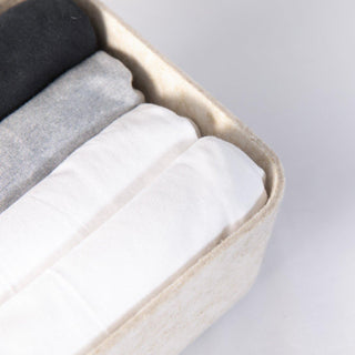 Beige Long Sculpted Bin with cloths inside